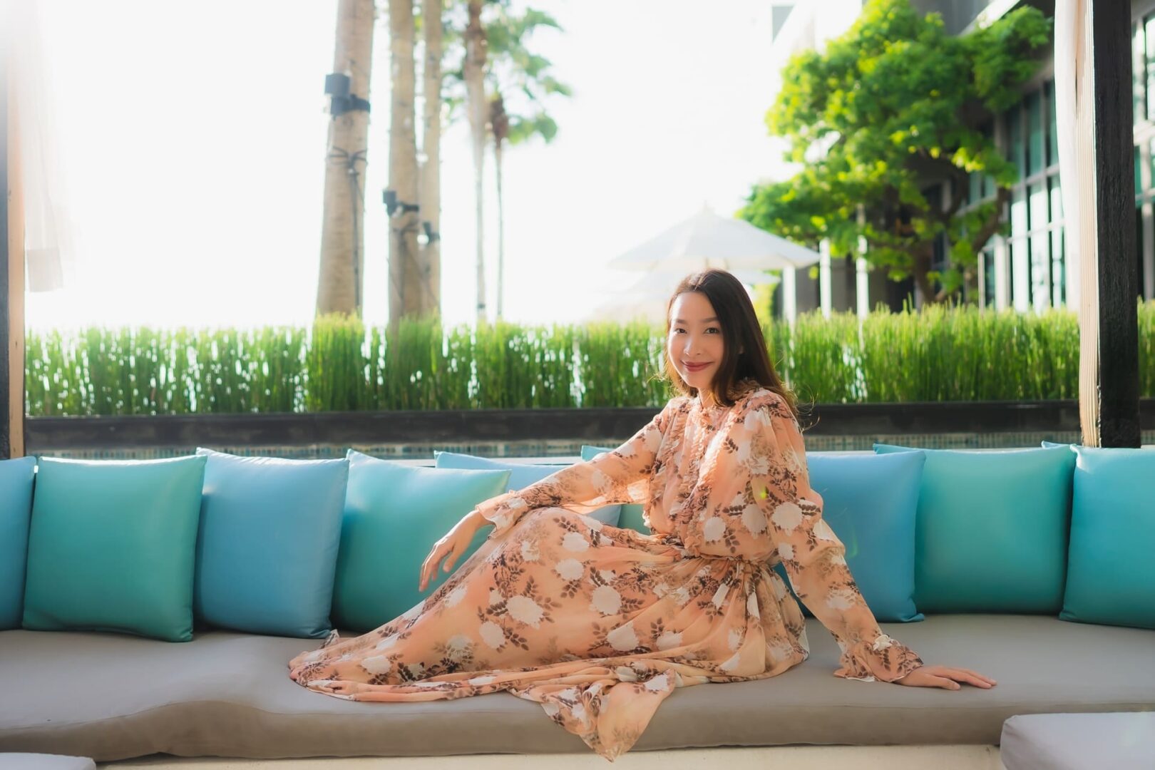 a woman guest in floral maxi wedding dress