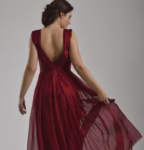 elegant woman in fashionable dress posing in the studio
