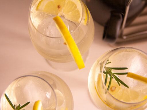 refreshing lemon and rosemary cocktails overhead
