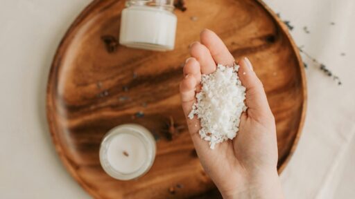 person holding a handful of candle wax