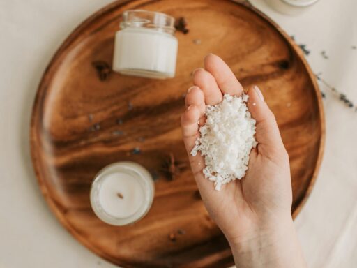 person holding a handful of candle wax